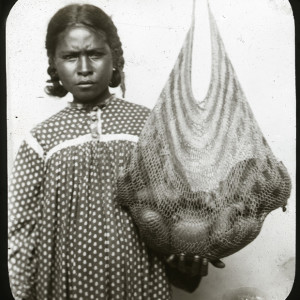 Woman with baby in a bilum. 1874-1890, Port Moresby, Papua New Guinea. Photo by Rev W G Lawes. Macleay Museum.